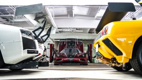 High-Performance Showdown in a Luxurious Garage​​ wallpaper