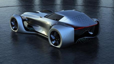 Futuristic Silver Concept Car Gleaming Under Lights wallpaper