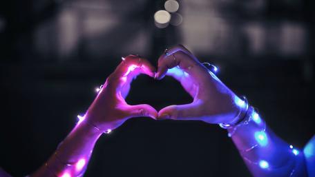 Glowing Heart Hands in the Night wallpaper