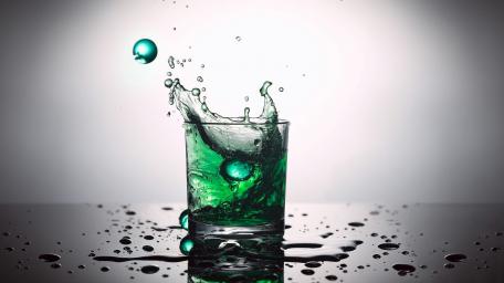Vivid Splash of Green Liquid in a Glass wallpaper