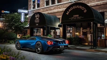 Sleek Blue Supercar in Urban Twilight wallpaper