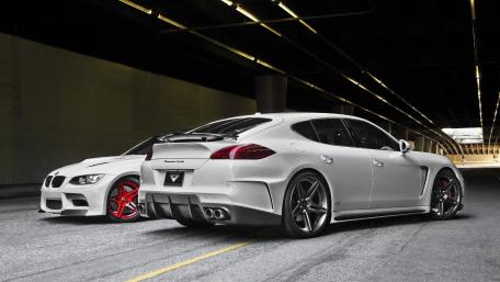 Sleek Performance Cars in Urban Lights wallpaper