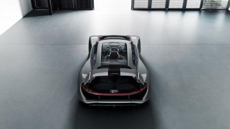 Sleek Audi AI:RACE in a Modern Showroom wallpaper