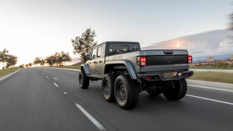 Speeding Jeep on Highway Adventure wallpaper