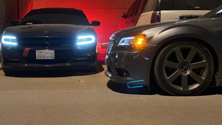 Sleek Cars in a Dimly Lit Garage wallpaper