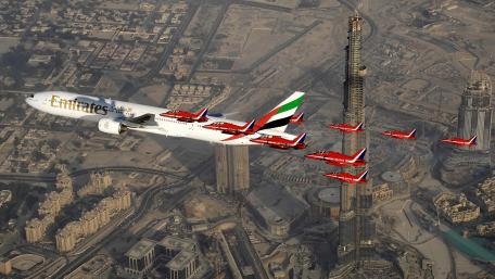 Emirates Airline Soaring High Above Dubai wallpaper