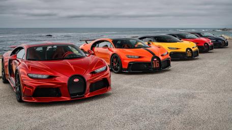 Sleek Supercar Ensemble by the Seashore wallpaper