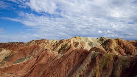 Earthen Waves Under Blue Skies- Zhangye National Geopark wallpaper