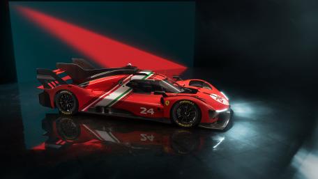 Sleek Red Ferrari 499P Racing Powerhouse wallpaper