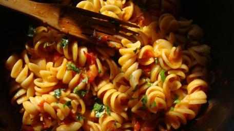 Delicious Pasta Stir in Sunlight wallpaper