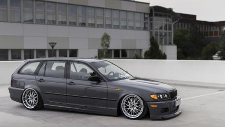 Sleek BMW E46 with Stylish Customization in Urban Setting wallpaper