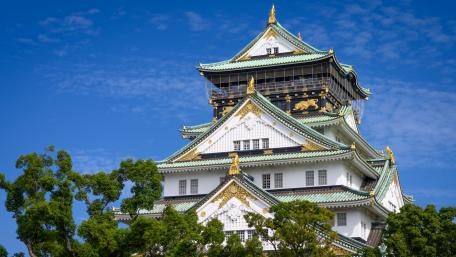 Majestic Osaka Castle Against Blue Sky wallpaper