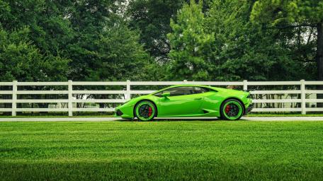 Green Supercar Bliss Amidst Nature's Embrace wallpaper