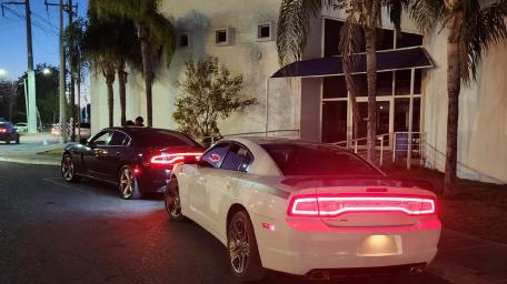 Charming Night Cars in Urban Setting wallpaper