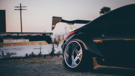 Sunset Silhouette of a Tuned Sports Car wallpaper