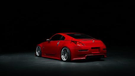 Sleek Red Coupe Spotlight wallpaper