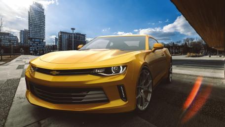 City Cruise in a Vibrant Yellow Camaro wallpaper