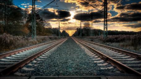 Sunset Voyage on the Iron Rails wallpaper