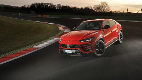 Racing Red Lamborghini Urus at Dusk wallpaper