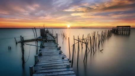 Serene Sunset at the Old Wooden Pier wallpaper
