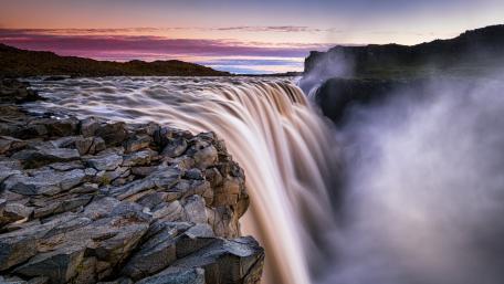 Majestic Waterfall at Sunset wallpaper