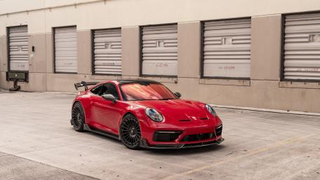 Sleek Red Porsche Awaits Adventure wallpaper