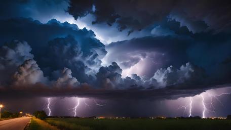Majestic Thunderstorm Over Tranquil Road wallpaper