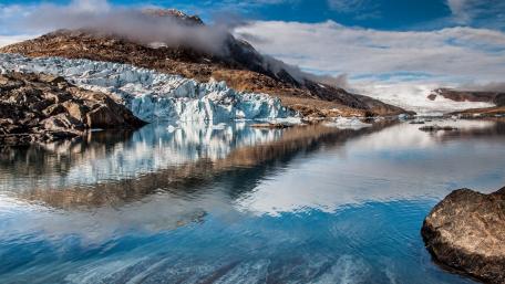 Majestic Ice Mirrored on Serene Waters wallpaper