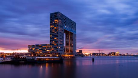 Sunset Silhouette of Pontsteiger Amsterdam wallpaper