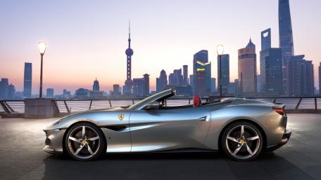Ferrari F8 Tributo Convertible Against Cityscape wallpaper