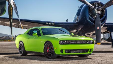 2015 Dodge Challenger SRT Hellcat next to Airplane wallpaper