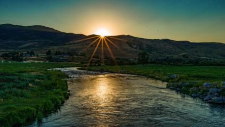 Golden Sunset Over Tranquil River wallpaper