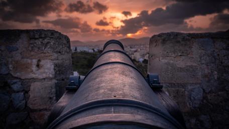 Cannon Overlooking Sunset Horizon wallpaper