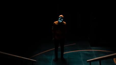 Mysterious Neon Masked Figure wallpaper