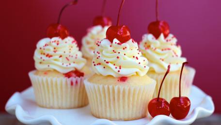 Delicious Cherry-Topped Cupcakes wallpaper