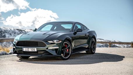 Sleek Ford Mustang Against Snowy Backdrop wallpaper