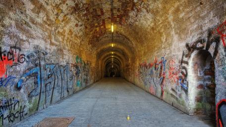 Urban Graffiti Tunnel with a Mysterious Ambiance wallpaper