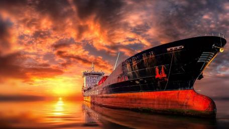 Majestic Vessel Beneath Fiery Skies wallpaper