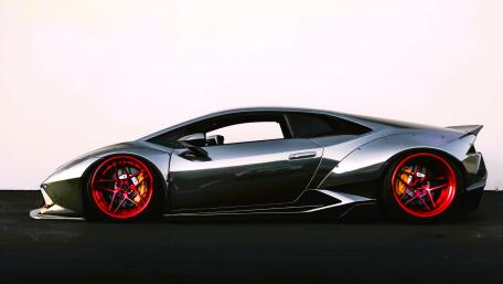 Sleek Silver Supercar Exuding Power and Style wallpaper