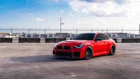 Red BMW M2 Dominance on Asphalt wallpaper