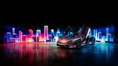 McLaren 720S amidst Neon Cityscape wallpaper