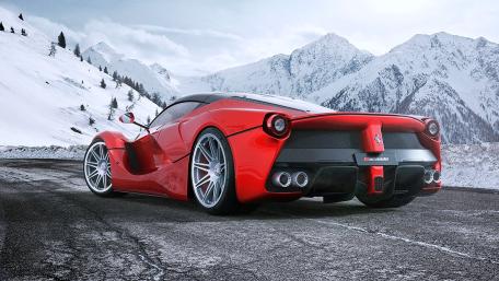 Red LaFerrari Against Snowy Mountain Backdrop wallpaper