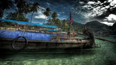 Tropical Escape with Serene Boat Views wallpaper