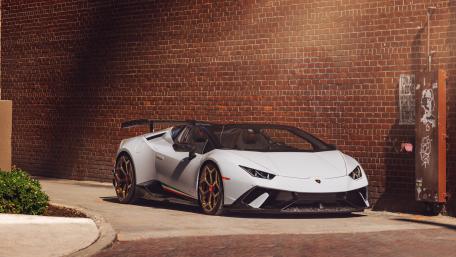 Lamborghini Huracan Elegance Against Brick Backdrop wallpaper