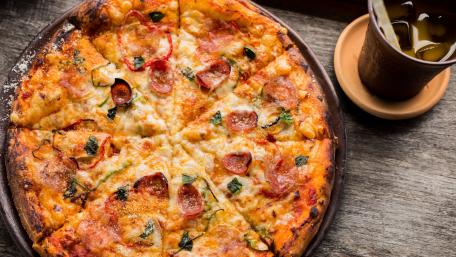 Decadent Pepperoni Pizza Feast wallpaper