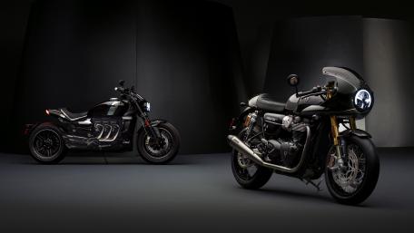Sleek Triumph Thruxton Duo Under Spotlight wallpaper