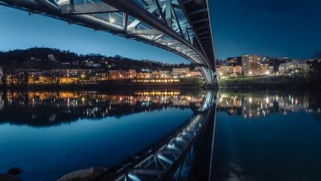 Moonlit Stroll Over Passerelle de la Paix wallpaper