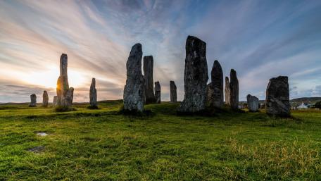 Ancient Monoliths in Tranquil Meadowlands wallpaper