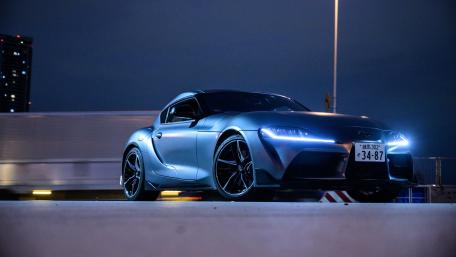 Toyota GR Supra in Night Cityscape wallpaper
