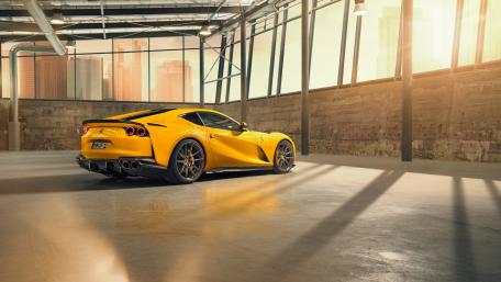 Yellow Ferrari 812 in Urban Setting wallpaper